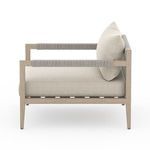 Opposite side profile highlighting armrest wrapping and seat cushion edge