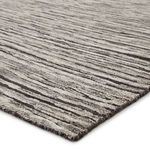 Close-up showing textured high-low pile with organic linear pattern and visible hand-knotting detail