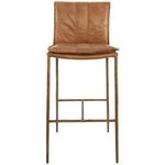 Front view focusing on the tan leather seat and stitching detail of the Mayer Stool