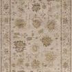 Traditional Turkish motif area rug in sand and pale sky tones with a vintage-style border pattern