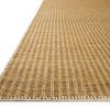 Close-up angled view showing the rug's texture and detailed whip-stitched edging