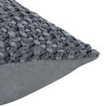 Close-up of corner showing detailed waffle texture and smooth fabric contrast on sham