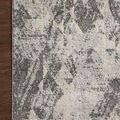 Corner close-up of Austen Stone Pebble rug showing finished edges and soft pile detail