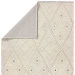 Back view showing solid light gray non-slip rug backing