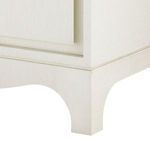 Close-up of Barrett dresser base with arched cutout detail in sand white finish