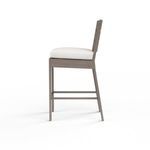 Side profile of Laguna Barstool highlighting footrest and seat cushion thickness