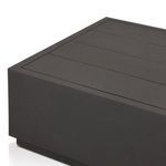Close-up angled corner shot showing both the slatted top and side panel of the table