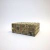 Angled side view highlighting box’s textured cube bone inlay and shape