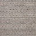 Taupe and grey geometric rug with layered diamond patterns and thick woven texture