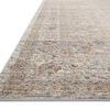 Close-up side angle showing the pile height variations and texture of the distressed pattern on the Indra Stone rug