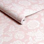 Rolled Rachel Ashwell Stipple Wallpaper showing white floral print on pink background in close view