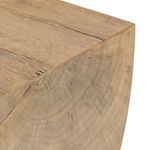 Close-up showing natural cracks and growth rings pattern on rounded tabletop end