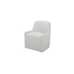 Three-quarter view showing the chair's rounded arms and smooth fabric texture