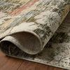 Close-up of rug partially rolled to show dense weave and backside construction on wooden floor