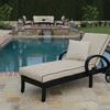 Monterey Chaise Lounge placed outdoors near pool with beige cushion featuring black piping and an additional small pillow