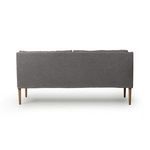 Back view presenting smooth, solid Dartmouth Denim fabric panel with four amber oak legs