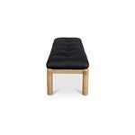Costello Bench end view showcasing rounded oak legs and black tufted leather cushion