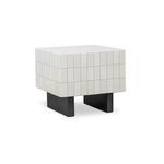 Three-quarter side view showing the depth and black matte base of the side table with glazed white concrete grid top