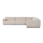 Rear angle showing Toland sectional armrest upholstery and loose back cushion in cream fabric