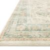 Close-up of Rosette rug corner showing plush edge and intricate border design in muted colors