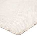 Close-up of ivory woven jute show texture and braided edges of the Vero Natural Trellis rug