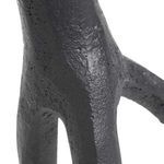 Close-up detail showing the irregular textured surface and natural variation in the cast iron material