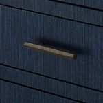 Hammered metal handle detail on Florence dresser drawer in a dark finish contrasting blue surface