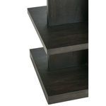 Close-up of layered shelving edges on pedestal base with charcoal oak finish