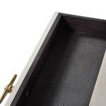 Close-up of drawer interior lined with black faux shagreen texture