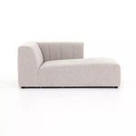 Side profile of Langham Channeled sectional showing low back and smooth chaise-like seat