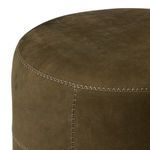 Close-up view of Camino Ottoman top edge with visible zigzag stitching and smooth leather