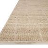 Side angle showing low pile, textured woven details, and neutral beige color of Asha Natural Rug
