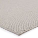 Close-up of handwoven polypropylene and polyester texture with light gray tones