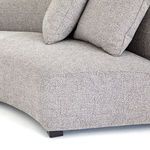 Close-up of sectional's seat and cushions showing grey linen-blend upholstery texture