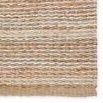 Close-up of the rug’s woven stripes and detailed fiber variations along the edge