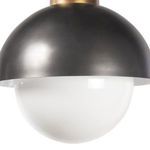 Close-up of milk glass globe under curved dark metal shade on Montreux Pendant