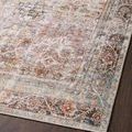 Close angled view of rug corner emphasizing fine weave and muted colors against dark wood floor