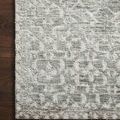 Close-up of rug’s dense pattern with varying pile height creating a tactile architectural design