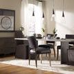 Dining room featuring Mimi Rider Black Dining Chairs around rectangular table with pendant lighting