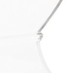 Close-up detail of clear acrylic chair's backrest crown shape and smooth edges