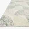 Side angle view highlighting the rug’s thickness and textured wool pile in gray and cream tones