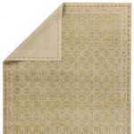 Partially folded rug revealing light underside and showing rug thickness