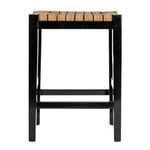 Front view of stool showing smooth black wood legs and crossbar footrest