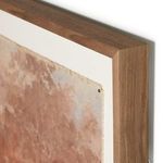 Close-up view of wooden frame corner highlighting grain and canvas edge