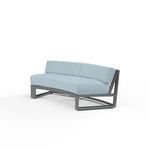 Curved outdoor sofa with low back, powder coated aluminum frame in brushed slate, and light blue cushions