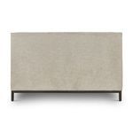 Back view of king bed with smooth linen-covered headboard and gunmetal base legs