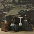 Osa Drinks Table displayed among diverse decorative side tables with textured and sculptural designs