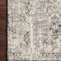 Theory Natural Grey Rug with a plush, soft pile featuring a subtle abstract pattern in grey and natural tones on hardwood ...