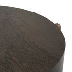 Close-up capturing iron surface and oak peg detail at the drum edge