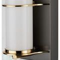 Close-up of polished brass rings curving around frosted glass tube of Blaine sconce